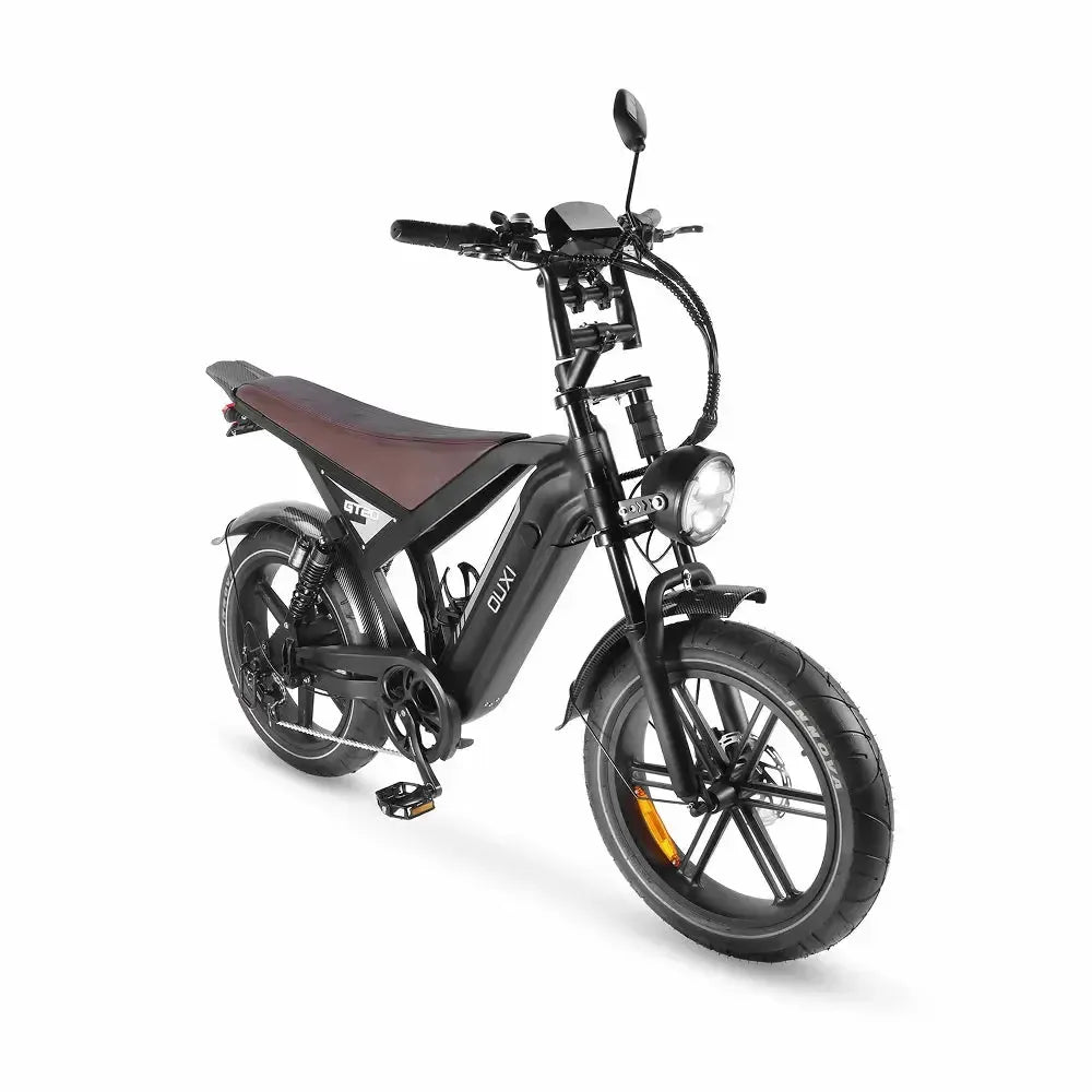 Ouxi GT20 Fatbike in Schwarz, schräge Vorderansicht mit leuchtendem rundem Scheinwerfer und Display am Lenker